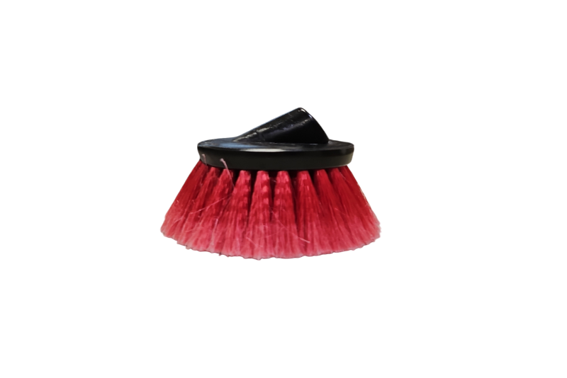Red cleaning brush with black handle on a white background