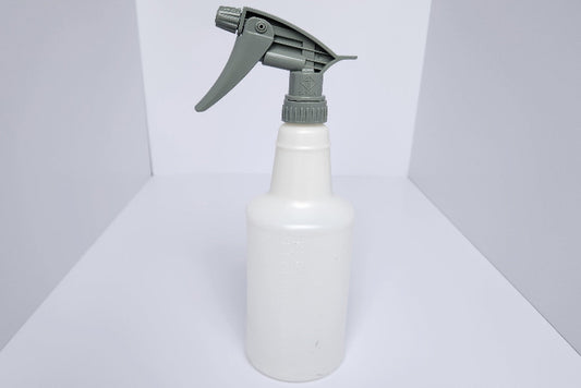 White spray bottle with gray nozzle on a white background