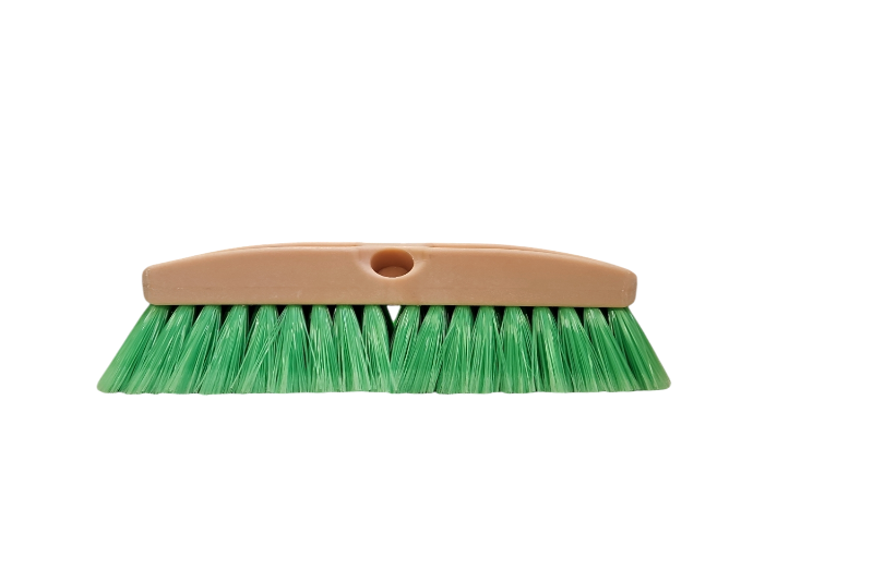 Green brush with a beige handle on a white background