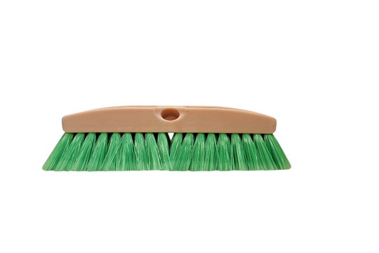 Green brush with a beige handle on a white background