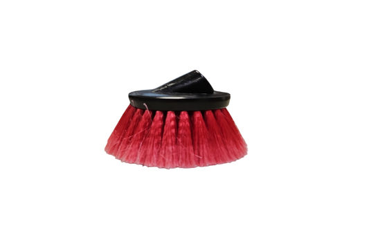 Red cleaning brush with black handle on a white background